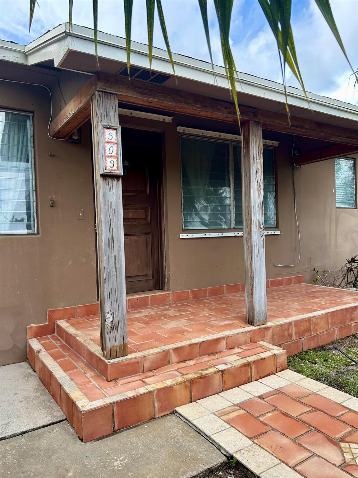 Located in College Park, Lake Worth Beach, rests this 5 bedroom, 4.5 bath home. Renovation needed! The home has great ''bones'' but is in need of love and restoration. The primary bedroom is massive and private, located upstairs whereas the other 3 bedrooms (in the main home) are on the first floor, off of the family room. Additionally, the home hosts a 1/1 attached garage apartment. The apartment has its own side entrance and is extremely private and separate from the main living quarters. With some clean up and construction, this home could be magnificent! Cash offers only!