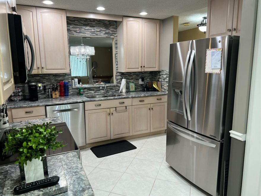 Renovated light & bright Single Family Home in a condo assoc. 2/2 + separate family room,+a/c enclosed indoor/outdoor patio. 1 car garage with storage & ceiling fan. This home has been SMART WIRED throughout, work the lights, Door locks, A/C and alarm from anywhere in the world. Renovated kitchen cabinets, with granite counter tops,Newly renovated bathrooms new vanities, both with step-in showers with top quality glass doors. No wallpaper or built-ins.Lots of closet space. Tile floors throughout. Accordian Shutters around home & roll down shutters on back patio.1 person must be at least 55 and have a 670 credit score or better.Great location Close to shopping & house of worship, both major hwys. Approx 6 miles to Downtown Delray & beach. Bus stop right outside community. Walk to clubhouse