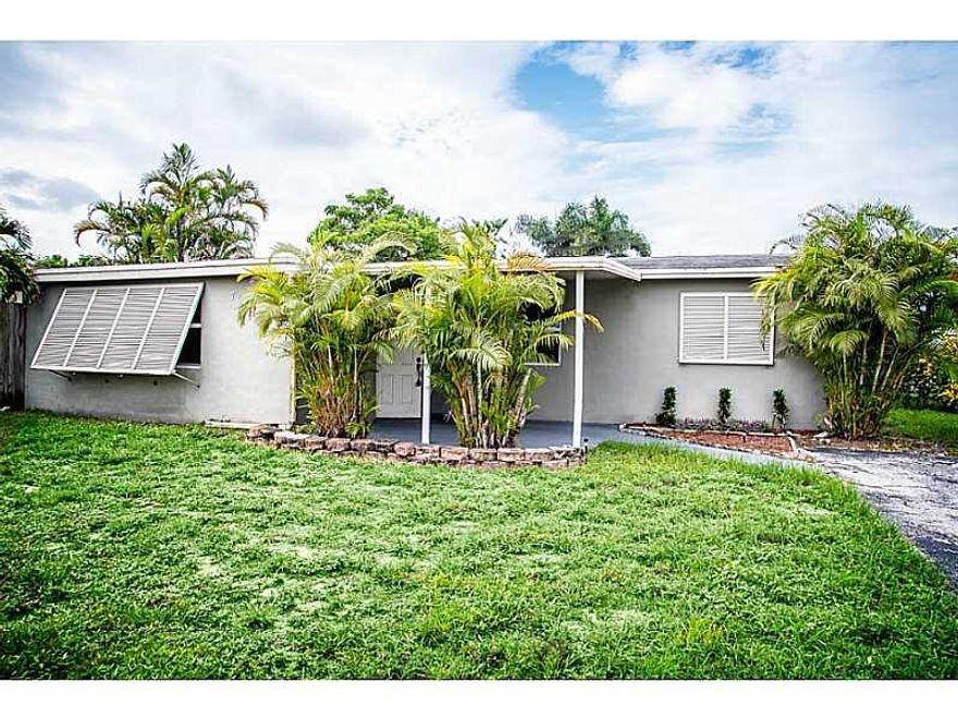 PRICED FOR IMMEDIATE SALE! 4/2 PLUS A STORAGE AREA ATTACHED TO THE BACK OF THE HOUSE APPROXIMATELY THE SIZE OF A SINGLE-CAR GARAGE! NEW HURRICANE IMPACT GLASS! TILE FLOORS MAIN LIVING AREA (CARPET BEDROOMS NEED REPLACING), NEW HOT WATER HEATER, NEW DRAIN  FIELD ON SEPTIC. OVER 1700 SQFT! WOOD KITCHEN CABINETS, WIRED FOR ALARM.