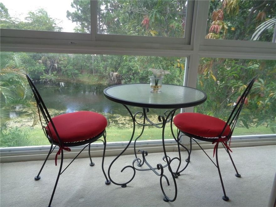 CORNER! TURNKEY! WATER VIEW! IMMEDIATELY RENTABLE! 2/1.5 in desirable, tranquil Durham area. Light and bright, this one has it all! A/C-3 years old and hot water heater only 4 years old. Updated electrical panel. 2nd shower installed, enclosed patio with extra storage and water view. Modern furnishings, parking space in front for easy access!  2 minute walk to pool, close to clubhouse.  Service contract available to transfer from Service America (expiration 6/2018) Must see!