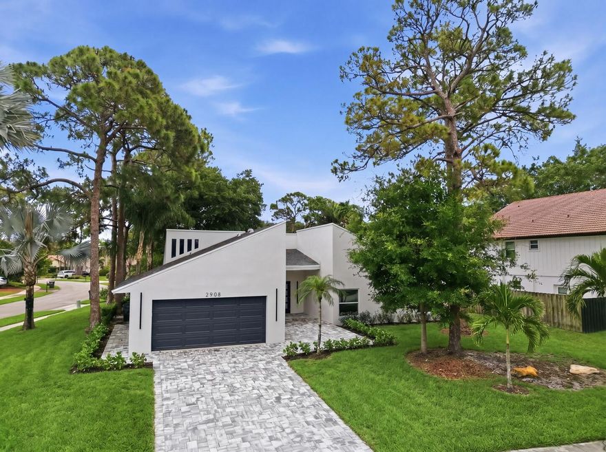 Beautifully redone 3-bedroom, 2-bath home on a desirable corner lot in Timbercreek, complete with a new roof and impact windows. Double door entry opens to a welcoming foyer and airy open floorplan designed for comfortable living and entertaining. Features include new neutral flooring, vaulted ceilings, and high hat lighting throughout. The dream kitchen offers a large center island, snack bar, tiled backsplash, and stainless steel appliances. Spacious primary suite with sliders to the covered patio and private ensuite bath. Enjoy indoor-outdoor living with a covered patio overlooking the oversized corner lot. Move-in ready with modern finishes and a light, bright feel throughout.