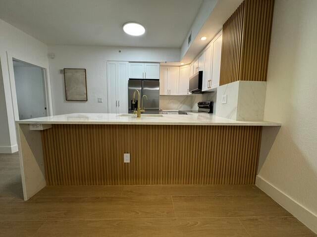 Photo of 1801 N FLAGLER Drive #103, West Palm Beach, FL 33407 (MLS # B26083108)