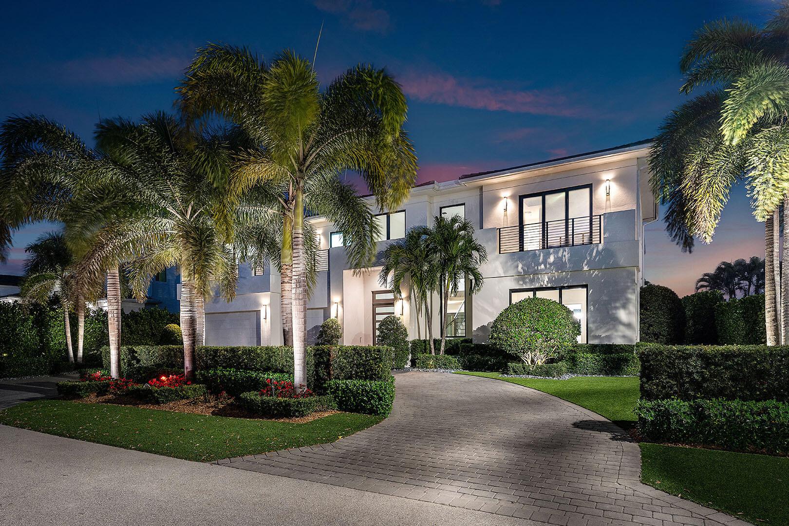 2352 Acorn Palm Road presents a rare opportunity to own a meticulously maintained estate that lives like new. This stunning residence, crafted by Virtuoso/Southeast Building Group, is positioned on a quiet, coveted street within the prestigious Royal Palm Yacht & Country Club. Thoughtfully designed with an open layout, the home features five en-suite bedrooms plus a library, five full and two half baths, a three-car garage, and 6,200+ square feet of refined living space.The interplay of contemporary design and clean, modern lines captivate from the moment you step inside. Every element has impeccable craftsmanship, from selecting exquisite materials to seamlessly integrating form and function. The gourmet kitchen, outfitted with custom Bontempo wood cabinetry, is a striking