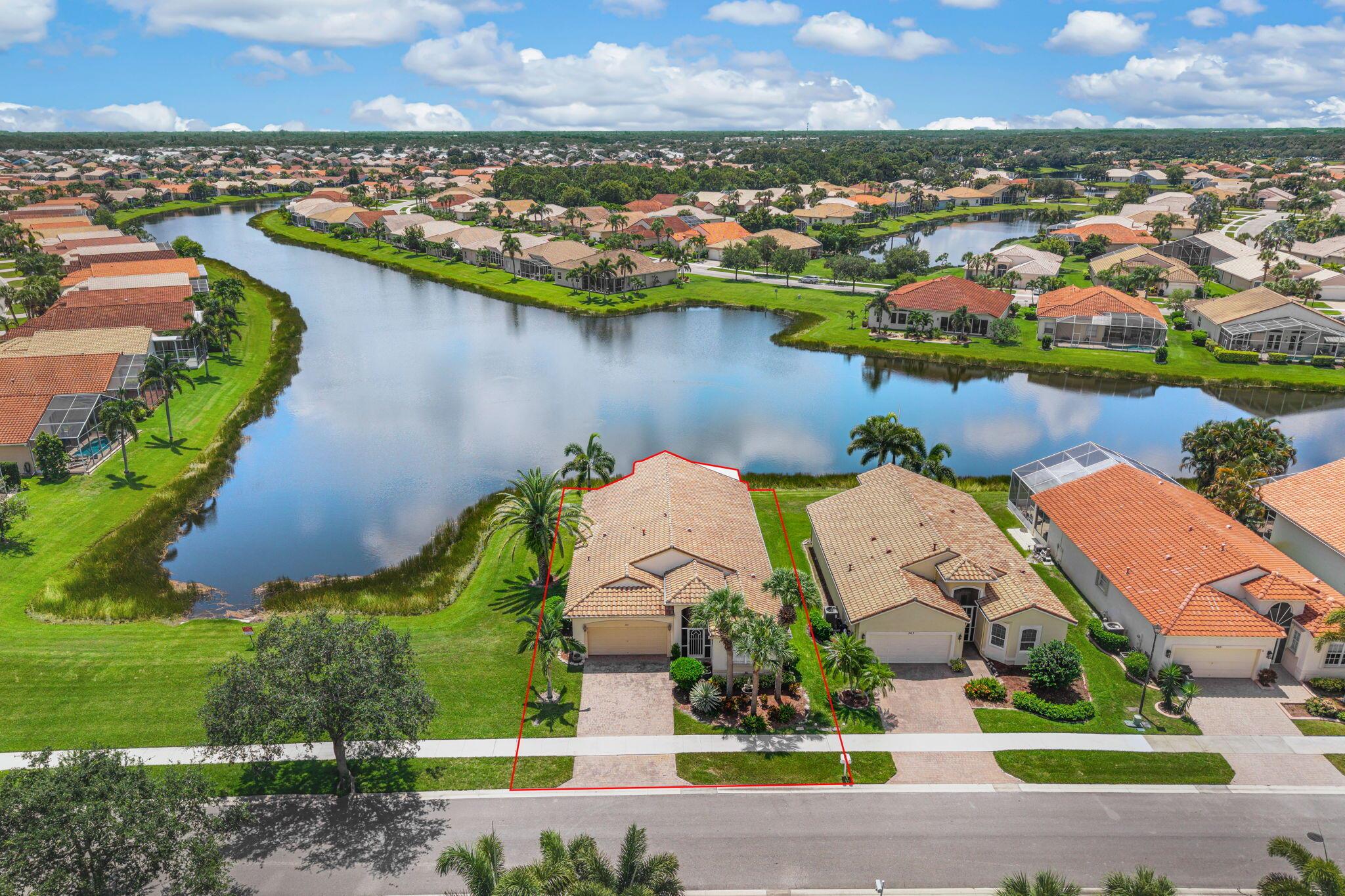 This is the Diamond you've been waiting for! Imagine relaxing with your morning coffee and enjoying the sun rise over the serene lake view every day. In excellent condition and meticulously maintained, this home was designed with entertainment in mind. The inviting Florida room was added in 2017. The island kitchen features granite counters and stainless appliances. Accordion shutters and new A/C in 2021. From the stately gated entry and tree lined streets to the world class clubhouse and sports center, Cascades has it all. This active, friendly 55 plus offers a gorgeous lobby, card rooms, arts,crafts, fitness center with saunas, library and ballroom. Outside you will find a resort style pool, spa, 9 hole executive golf course, tennis courts, bocce courts, shuffleboard and pickleball.