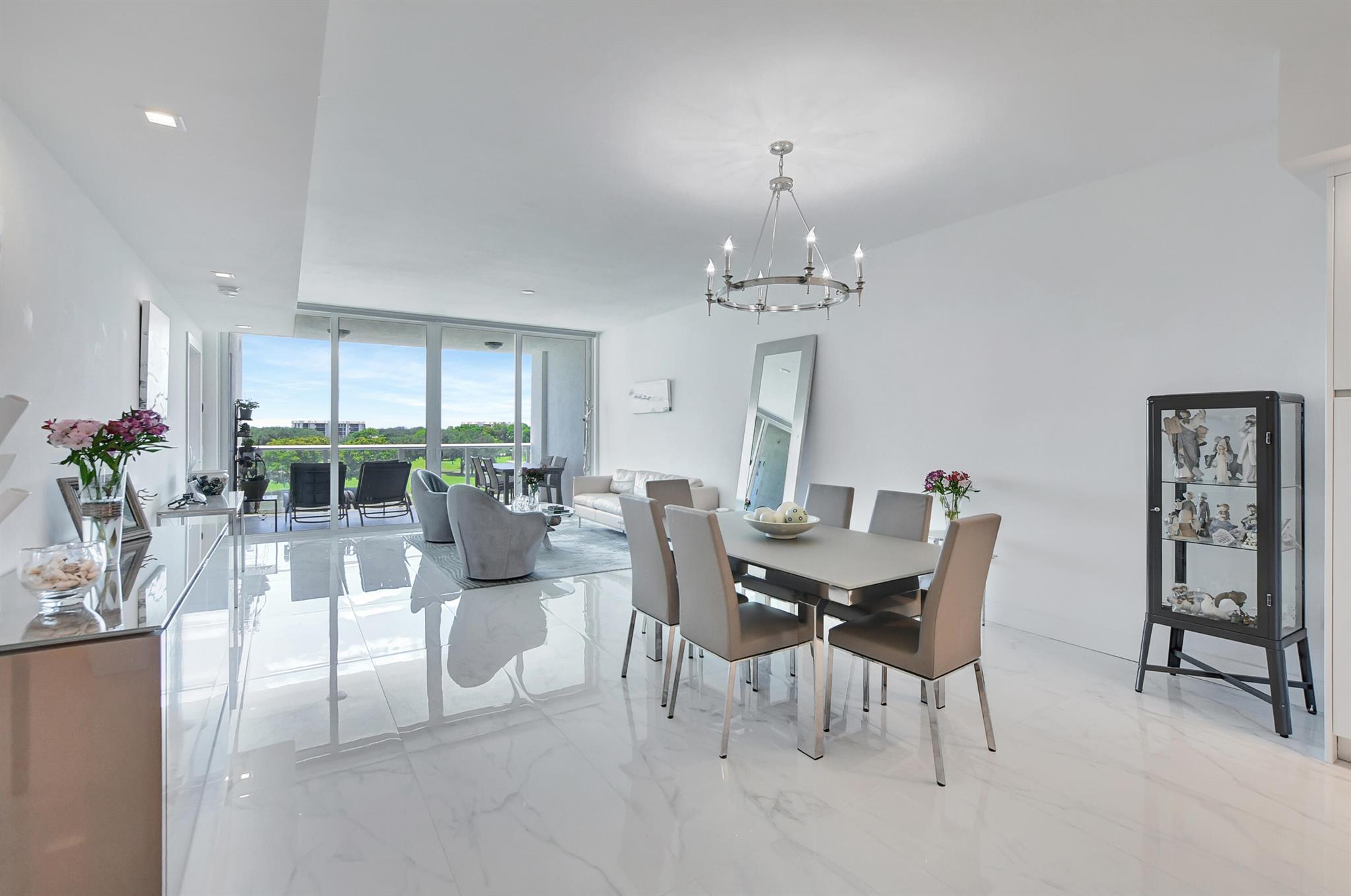 Stunning 2/2.5 + den Opal residence with private elevator entry, flow through design, full hurricane impact floor to ceiling windows, electric shades, and custom closets. Gourmet kitchen with Italkraft cabinets & Wolf Sub-Zero appliances. 24 hour front desk attendant, valet parking, card & social rooms, fitness center, resort style pool, and more. ~Imagine life inside the Nation's #1 Private Residential Country Club offering resort-style living. PLAY our 4 Golf courses, 27 Tennis courts and 14 Pickleball courts; SHOP our retail store, golf and tennis pro shops, DINE in our 9 restaurants. Mandatory Join Fee: $90,000 & Annual Social Dues $18040 *** SELLER IS OFFERING A $90k CREDIT AT CLOSING WITH FULL PRICE OFFER!!!