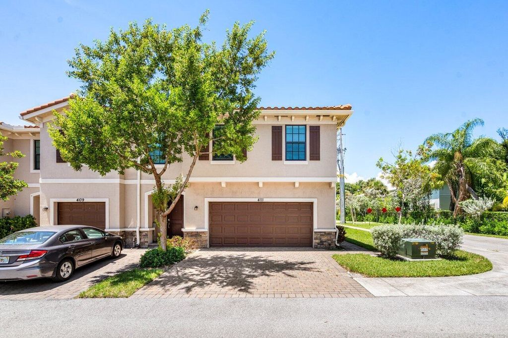 Photo of 4111 Plum Tree Lane, Riviera Beach, FL 33410 (MLS # R11126977)