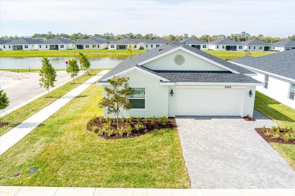 Photo of 6402 NW Windwood Way, Port Saint Lucie, FL 34987 (MLS # R11057969)