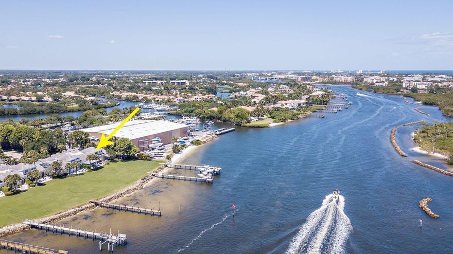 Magnificent recently renovated waterfront property with stunning Intracoastal views. This is probably the best waterfront renovation ever to be completed in Jonathan's Landing! This amazing 3 bedroom, 3 1/2 bath townhome is in the much-desired Port Dickinson village. A beautiful private in-ground Zen type pool greets you as you walk into the peaceful enclosed courtyard. The sun filled open concept home features a beautiful dining area, spacious living room and gourmet kitchen that are separated by a free standing Flare see-through glass fireplace.Living space opens directly via stackable impact doors to a spectacular outdoor entertaining area.