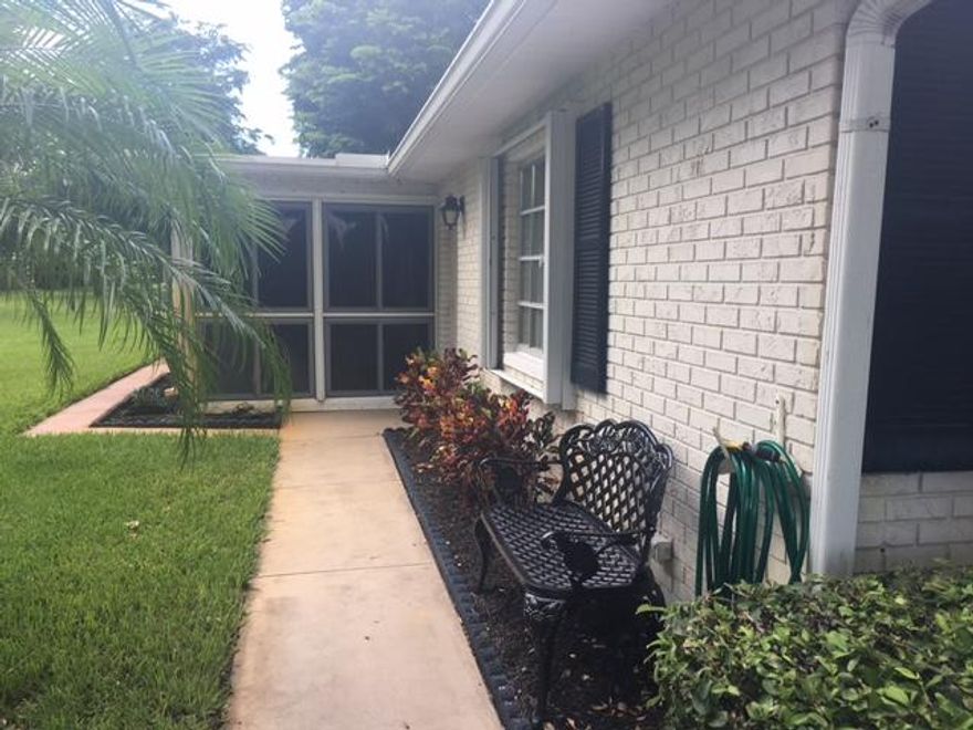 Welcome to the active 55+ community of Limetree.  Pet Friendly, close to beach, major highways, dining and shopping.  This 1 Bedroom 1 1/2 Baths features a bonus Florida Room.  Within the last 6 years the following have been updated A/C, Hot Water Heater, Washer/Dryer, Refrigerator, Microwave.  Accordion shutters on villa with hurricane panels for Florida Room.  Extra closet space throughout and pull down stairs to attic.