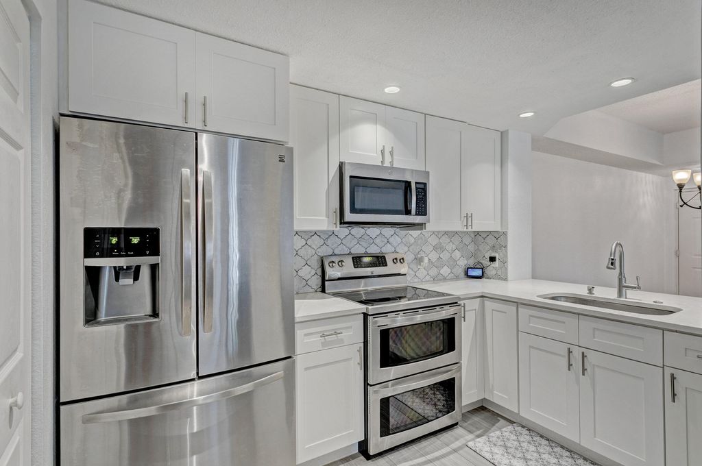 Photo of 3018 Alcazar Place #101, Palm Beach Gardens, FL 33410 (MLS # R10800904)