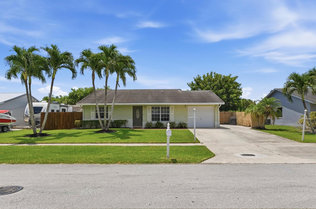 Photo of 4732 CARTHAGE Circle S, Lake Worth, FL 33463 (MLS # B26053628)