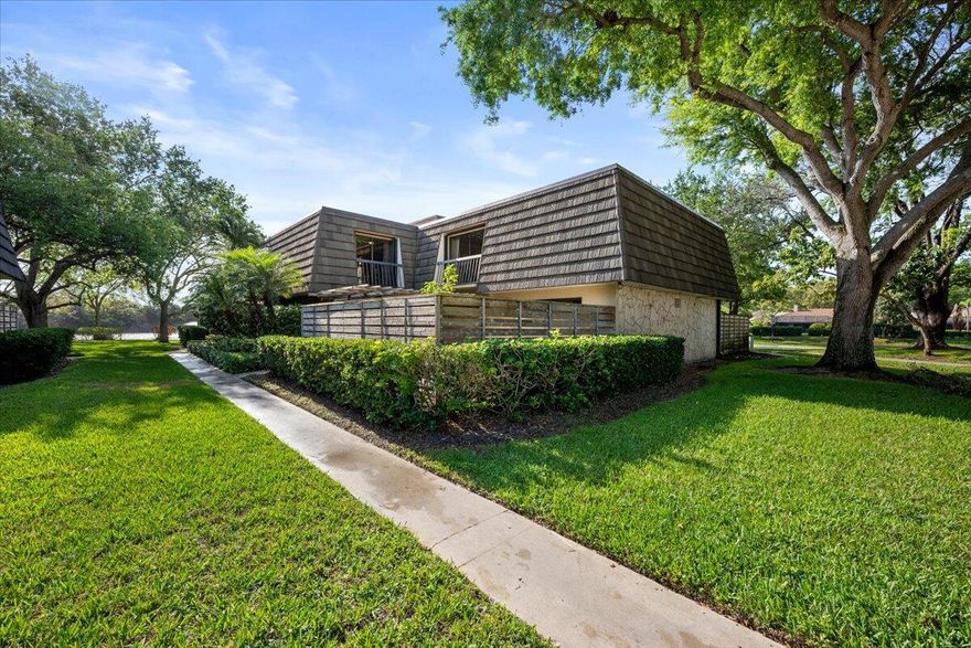 Welcome to this beautifully updated 3 bedroom, 2.5 bath townhome located in the highly desirable Glenwood subdivision of PGA National in Palm Beach Gardens. Offering a perfect blend of comfort and style, this residence features a remodeled kitchen complete with stainless steel appliances, decorative lighting, and modern finishes that flow seamlessly into the main living areas. Durable vinyl flooring extends throughout the home, creating a clean and cohesive look. The thoughtfully updated bathrooms add a fresh, contemporary feel, while major upgrades provide peace of mind, including a brand-new roof (2025), newer hot water heater, and updated kitchen appliances. Storm protection is fully in place with accordion hurricane shutters on the second floor and panel shutters on the first.