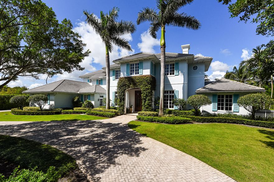 Located in the Seminole Landing, this custom built waterfront house has been impeccably maintained and is ready for you to call home. The five bedroom, four and one half bath home also features a separate home office, an air-conditioned three car garage, 137 feet of water frontage and dock. When entering through the front door, you immediately notice the spaciousness of the 12 foot high coffered ceilings; the adjacent living room and formal dining room are filled with of natural light - showcasing the attention to detail. Off the living room are three sets of French doors that open to a covered lanai that overlooks the 40' long pool and heated spa, making this home perfectly laid out for indoor and outdoor entertaining. The open kitchen offers plenty of marble countertops and beautiful wood cabinets to satisfy any chef; as well as top of the line appliances, natural gas cooktops, center island and over sized sinks. The kitchen is beside a casual family room with fireplace and breakfast nook. Then from the family room, three more French doors open to an outdoor seating area with summer kitchen / grill.   On the second floor is a spacious master bedroom with his and her closets and  a covered balcony overlooking the dock and waterway.  Down the hall are three more guest rooms as well as a large covered balcony with flat screen TV.    The home was built with the finest materials and to all the latest building codes, including poured concrete block construction with all impact rated windows and doors, concrete tile roof, and a full house generator.    Seminole Landing is conveniently located in between PGA Blvd and Donald Ross Road, sharing the same entrance to the Seminole Golf Club.  Seminole Landing is home to some of the highest priced homes in Palm Beach County.