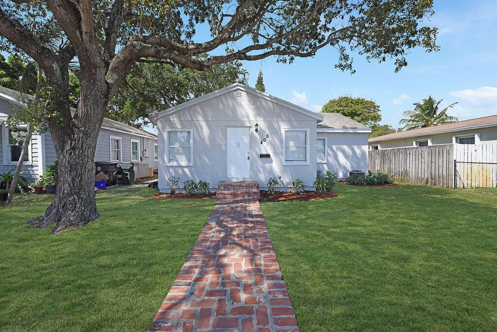 WOW! Move in ready 3 bedroom single family home fully remodeled in 2021 including a brand new roof, flooring, white shaker wood kitchen cabinets, stainless steel appliances, ext electrical panel & main service, bathroom, A/C, hurricane panels, paint (interior and exterior), laundry room, premium blown insulation, landscaping and more! LARGE fenced in yard, plenty of parking, No HOA! FHA/VA financing welcome! Close to beach, I-95, downtown, historic district, shopping, schools, places of worship and more. HURRY THIS WILL GO FAST!