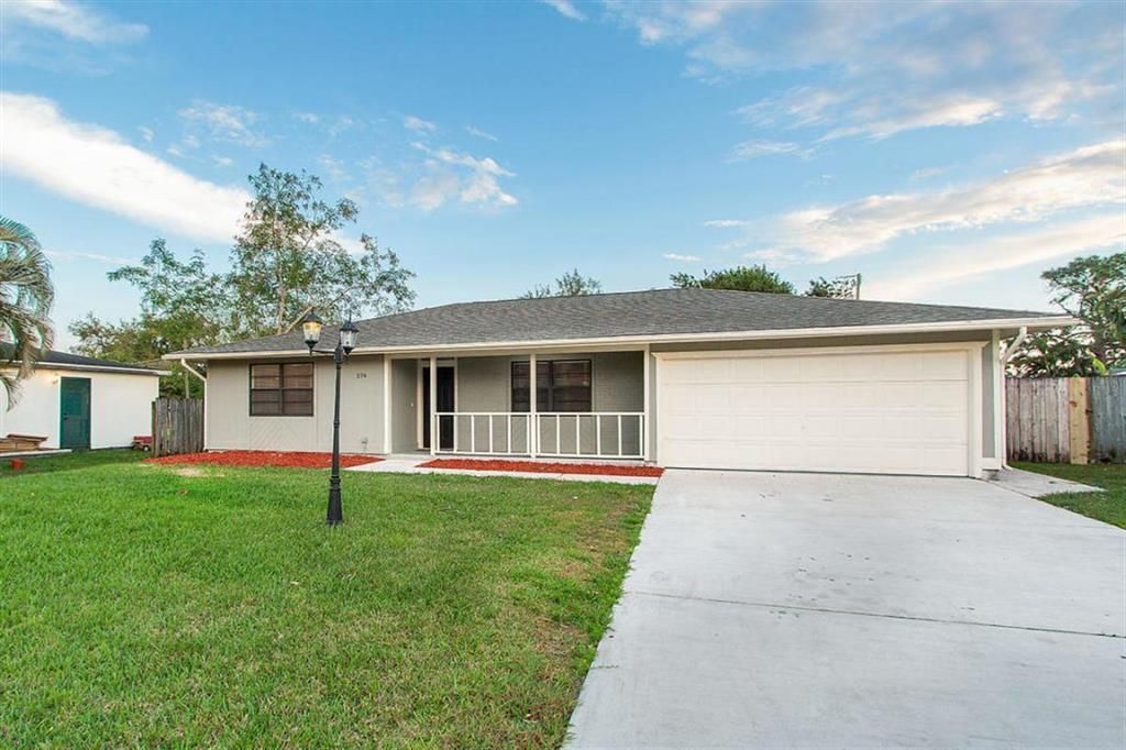 Photo of 574 NW Marion Avenue, Port Saint Lucie, FL 34983 (MLS # R10765263)