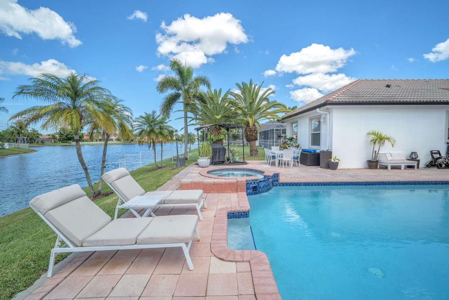 Gorgeous waterfront home in the highly sought-after Stoneridge Lake Estates of Pembroke Pines. This 5-bedroom, 2.5-bath residence features a heated saltwater pool and jacuzzi overlooking serene lake views—perfect for year-round indoor-outdoor living. The remodeled kitchen offers a clean, modern design with a window facing the pool, creating a bright and functional space. The layout includes spacious bedrooms, including a primary suite with lake views, en-suite bath, and walk-in closet. Additional features include a two-car garage and laundry room with utility sink. Located in a gated community with 24-hour security, tennis courts, playground, and cable included in HOA. Priced to sell—homes like this rarely come available.