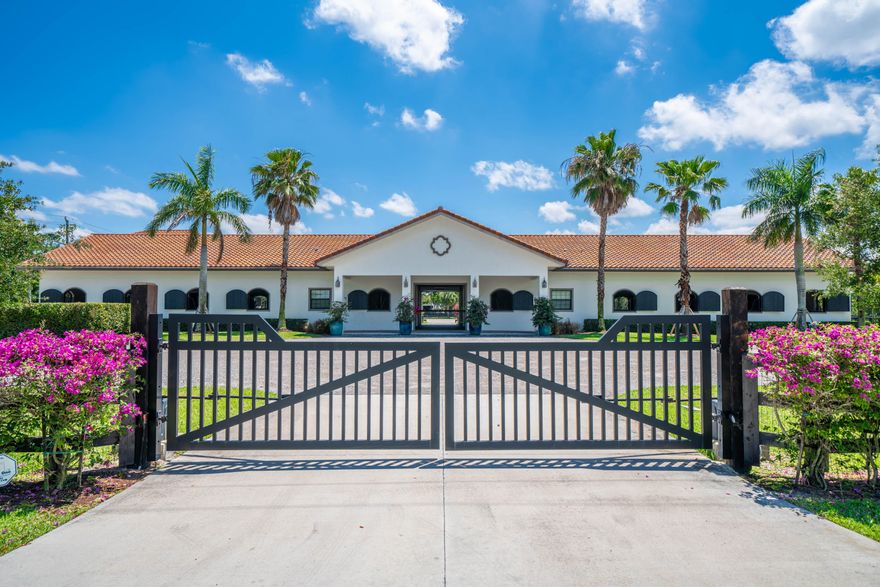 This 4.3 acre property is an equestrian's dream! Completely renovated 4 bedroom, 3 bath home with a state of the art kitchen, impact windows & doors throughout. The center aisle barn has 16 stalls, with tack & feed rooms, 4 wash racks, a large storage area, a 150' x 185' Wordley Martin riding arena and 11 paddocks! There are two separate apartments. One apartment is above the storage area and has 3 bedrooms, a full kitchen and living area. The second apartment has 1 bedroom and 1 bathroom. Everything has been re-done! This exceptional 4+ acre Paddock Park 2 property will not last!
