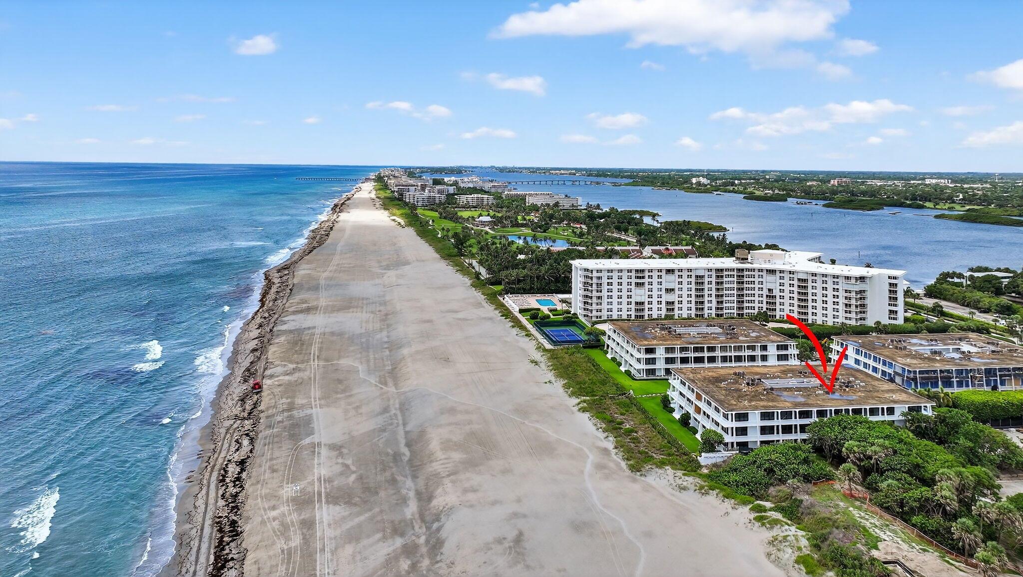Landmarked Palm Beach modernism meets a rare opportunity to create your ideal oceanfront home! Designed by renowned architect Gene Lawrence, The Reef is a celebrated example of mid-century modern architecture. The Reef offers direct beach access, an oceanfront pool with cabanas, a new fitness center, garage parking, doorman service, and pet-friendly living! This corner residence in the North Building offers a massive wrap-around balcony with sweeping beach, ocean, and park views. Its light-filled layout and multiple exposures create a seamless indoor-outdoor connection, perfect for capturing sunrises, sea breezes, and the sound of the waves. Both bedrooms feature remote-controlled blackout curtains, allowing you to enjoy full light or complete privacy at the touch of a button.