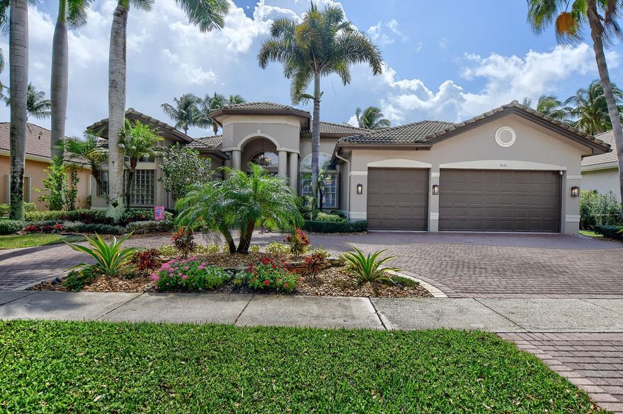 Spectacular one story lakeview masterpiece,  Raphael model in the sought after Saturnia Isles. Built and designed with pure elegance and warmth with a heated pool, features 5 bed plus office, 4 baths,3 car garage, overlooking the private lake, 3 way split, the formal living area is open with grand ceilings and great lake views. Large gourmet kitchen with oversized center island, custom wood cabinets, new quartz counter tops, SS appliances, opens up to a beautiful family room and large eat-in kitchen area, full house generator, accordion hurricane shutters, tiles in main living area, engineered wood flooring and tiles in bedrooms, tiles in main living area, recently added pool enclosure, water softening system. House shows like a model. Great Boca school