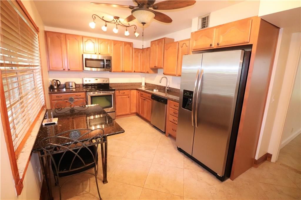 Photo of 3505 OAKS WAY #103, Pompano Beach, FL 33069 (MLS # F10289766)