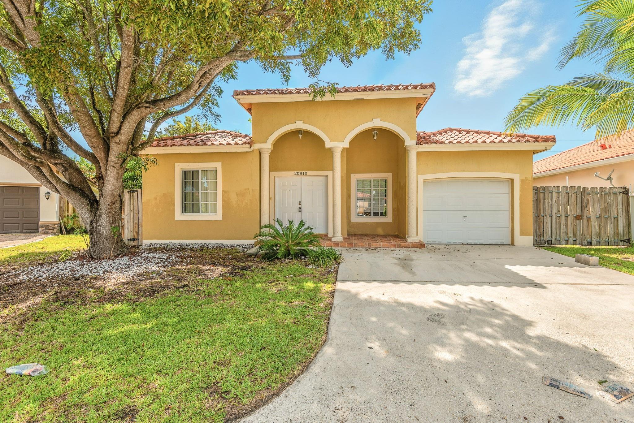 Beautiful one-story home with 4 bedrooms and 2½ bathrooms, featuring a 1-car attached garage and a welcoming front porch. The double-door front entry opens to a foyer leading into a spacious open floor plan with a modern kitchen and bar, complete with a decorative backsplash. Enjoy two glass sliding doors in the living room and breakfast area providing seamless access to the wood-fenced backyard, plus an additional bedroom with sliding doors to the backyard. Perfect for entertaining and comfortable family living. One or more photos have been virtually staged to showcase the home’s potential. Schedule a showing today!