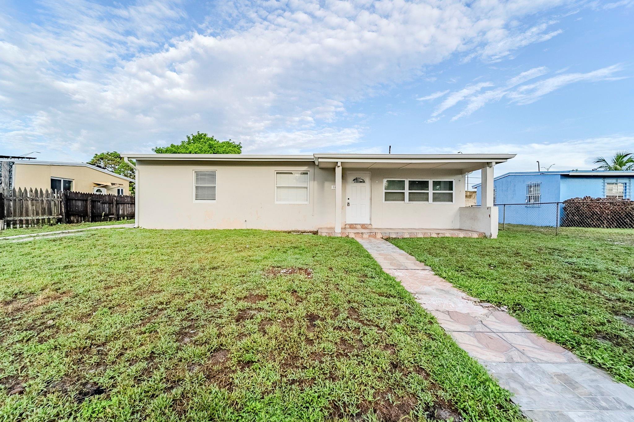 Discover this inviting 1-story home featuring 3 bedrooms and 1 bathroom. The kitchen offers stainless steel appliances, bright white cabinets, and accent lighting that enhances the space. A welcoming front porch leads to a spacious backyard with a chain link fence, providing plenty of room for outdoor activities. One or more photos have been virtually staged. Schedule a showing today!