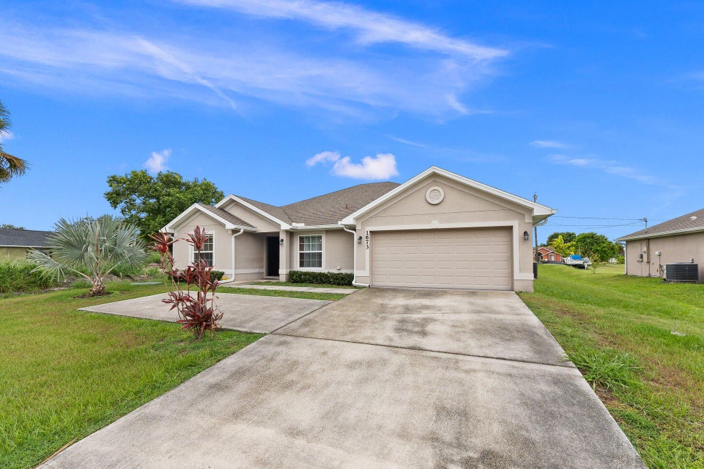 Photo of 1673 SE Airoso Boulevard, Port Saint Lucie, FL 34984 (MLS # R10997185)