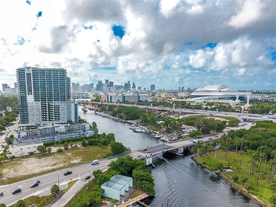 Waterfront living in the heart of Miami's River District!  This spacious 1-bedroom unit (originally a 2-bedroom, converted to maximize living space) features updated flooring, renovated bathroom, and modern appliances. Enjoy a private balcony with serene water views and abundant natural light.  The unit includes a smart Google Nest A/C system and secure fingerprint entry. Assigned parking included.  Serenity on the River offers excellent amenities including pool, jacuzzi, gym, elevator, BBQ area, and laundry facilities. Prime location near Jackson Memorial Hospital, Downtown Miami, major highways, and shopping.  Ideal for end-users or investors. Rentals allowed with 1-year minimum. Association approval required. HOA includes water. Unit has no washer/dryer inside; laundry facilities available in the building. Storage units available for rent ($20-$50/month).  Recent upgrades include flooring, bathroom finishes, and appliances. Smart thermostat (Google Nest) allows remote A/C control. Fingerprint entry system installed (can be changed by new owner).  Furniture may be negotiable depending on offer.  1 assigned parking space (#245) plus guest parking available