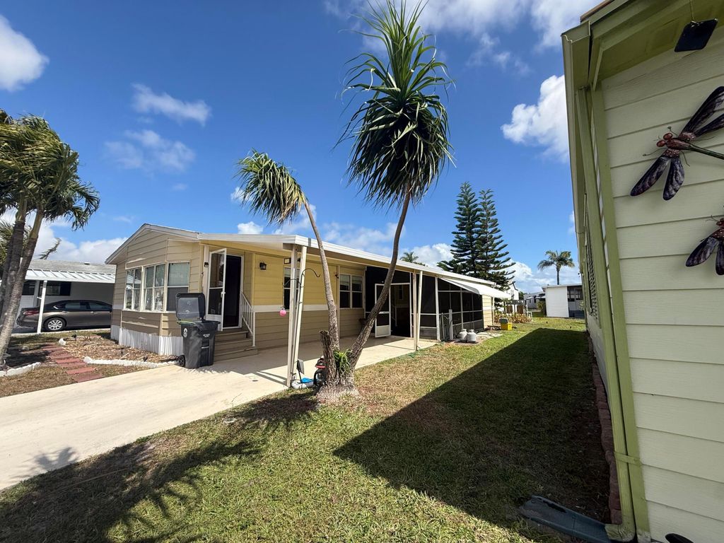 Photo of 6092 Palm Breezes Drive, Lake Worth, FL 33462 (MLS # B26002706)