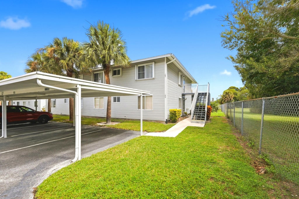 Photo of 105 SE Village Drive, Port Saint Lucie, FL 34952 (MLS # B26080738)