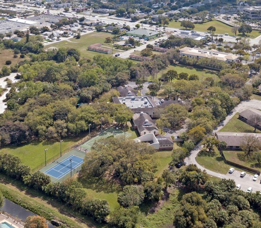 29,000+ SF Office Building plus 24,000 SF dormitory building + storage building and sports courts.

The Office Building is ripe for updating for owner/user or for investment with over 80 private offices already built plus numerous conference rooms, restrooms, outdoor deck areas, fitness center and sports courts all onsite.  Fabulous Palm Beach County location between I95 and Florida Turnpike.  Move your company to Palm Beach County without the need to build new! 

The dormitory building has 24 sleeping suites, all with private bathrooms, plus numerous family rooms, dining rooms, kitchens and offices.  The current Tenant is willing to lease back this building after sale if Buyer does not need it.

The 8.86 acre site has loads of parking and plenty of room for an additional building.