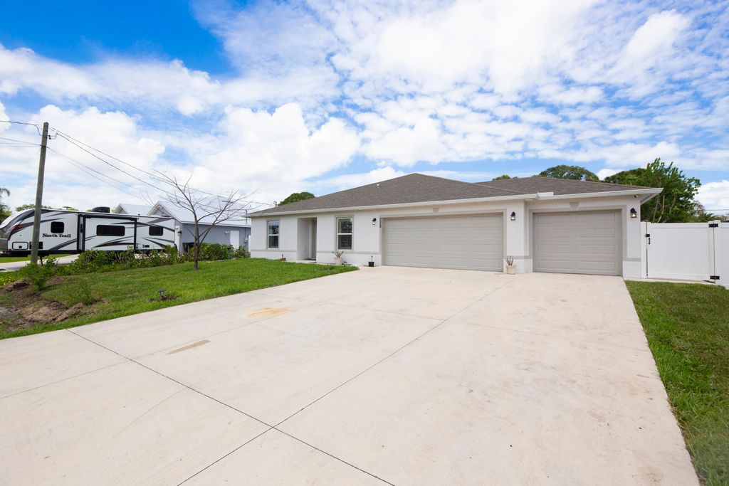 Photo of 228 SE Sims Circle, Port Saint Lucie, FL 34984 (MLS # B26014563)