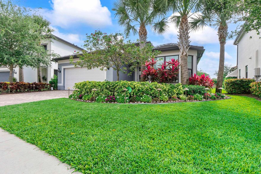 Turn heads the moment you arrive at this stunning 2021-built showpiece in the gated community of Oak Tree by Pulte Homes. This 3BR/2BA residence delivers true indoor-outdoor luxury with dramatic zero-corner sliding glass doors that fully open the living area to a breathtaking screened lanai and resort-style saltwater pool and spa—heated and accented by three cascading waterfalls. Inside, a designer kitchen shines with upgraded KitchenAid appliances, including a wall oven, gas cooktop, and counter depth refrigerator with ice and water through the door, plus upgraded 42 inch upper cabinetry and arabesque backsplash. The laundry room is equally refined with built-in cabinetry, countertop, and upgraded Whirlpool appliances. The lush foliage of the exterior is highlighted by low-voltage landscape lighting. Crown molding, smooth walls, smart home features, and a versatile flex space complete the home. HOA includes high speed internet, HBO Max, lawn care and access to pickleball, fitness center, and clubhouse. A rare, turnkey luxury retreat.   All information and measurements are believed to be accurate but not guaranteed. Buyer should verify with inspection.