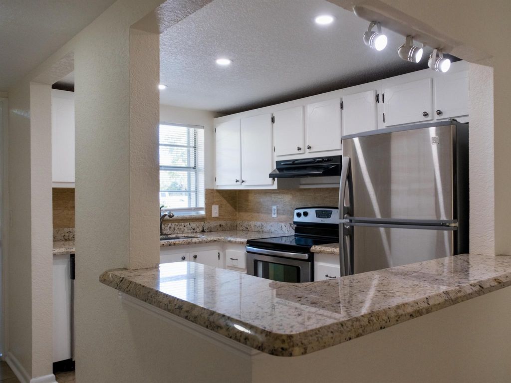 Photo of 1638 Embassy Drive #104, West Palm Beach, FL 33401 (MLS # R10909189)