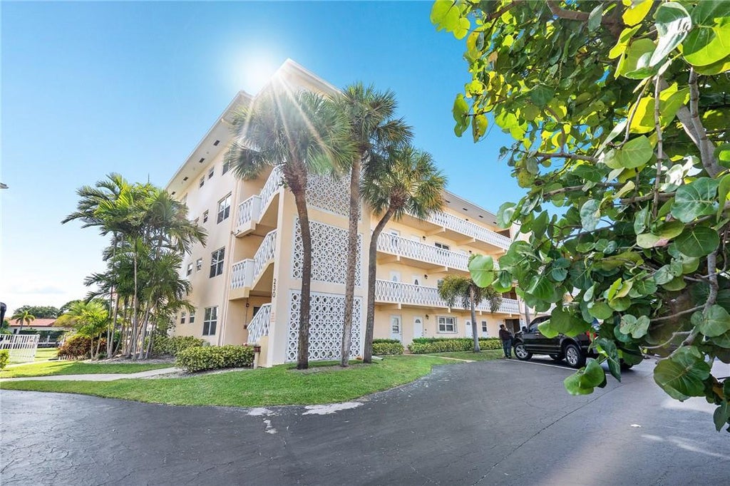 Photo of 230 N FEDERAL Highway #103, Deerfield Beach, FL 33441 (MLS # B26077844)
