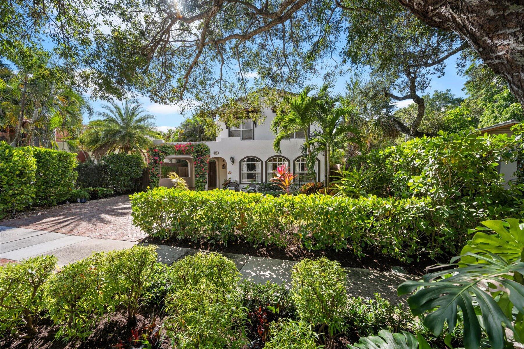 Impeccably renovated 1926 Historic Designated Home located in the esteemed Flamingo Park district. This historic gem features 3 bedrooms, 2 full bathrooms upstairs, including a built-in bed for additional guests in the sitting room and an additional full bathroom downstairs. The property includes a 500 sq ft pool house with a kitchen, bathroom, and versatile sleeping configurations, which can accommodate up to 4 guests for sleeping.Notably, the property boasts one of the highest elevations in West Palm Beach, requiring no flood insurance. The exterior showcases a heated pool with a spa, an outdoor kitchen, fire pit, and a private outdoor shower area.The meticulously landscaped property offers a 400 sq ft covered patio, fans, and an elevated deck with a pergola overlooking the pool.