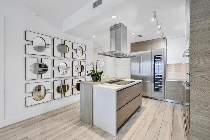 This STUNNING, fully designer furnished, contemporary residence delivers effortless downtown Boca sophistication and city walkability. With a bright open floor plan, refined neutral palette, high ceilings, wood-look ceramic tile flooring, designer wallpaper, statement lighting, and floor to ceiling windows create a designer-curated, hotel-inspired atmosphere throughout. The show-stopping European kitchen features quartz waterfall countertop, ceiling-height Italian cabinetry, BOSCH appliances, wall oven/microwave, cooktop and an integrated 50-bottle wine towerâ€''an entertainer's dream blending style and function. Two spa-style ensuite baths with double vanities offer hotel-level comfort. The glamorous primary suite invokes a sophisticated feel that makes you want to linger.  CONTINUED.. The suite includes floor-to-ceiling sliders, blackout shades and a fully outfitted walk-in closet. Residence includes full-size washer/dryer, keyless entry, two garage spaces and bike storage.
Building amenities offer resort-caliber comfort and style: rooftop sundeck, whirlpool with cabanas, spa, sauna, steam room, fitness center, wine lockers, concierge, valet and 24-hour security and much more. You must come and see to experience it for yourself.
Moments from Mizner Park. Walk to dining. Stroll to entertainment. Live beautifully.