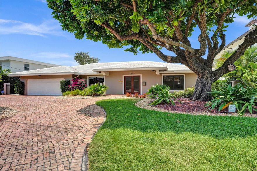 Bring your boat to this stunning waterfront home in Coral Ridge Country Club. Recently remodeled 4br/3ba + office on 85' of water with a new composite dock and 20k lb boat lift in 2019. Well appointed interior features include a split floor plan with impact windows and doors, marble and tile floors throughout, updated kitchen, bathrooms and custom closets. With a large covered patio and new tiki hut and outdoor kitchen in 2021, this home is the epitome of outdoor Florida living. Saltwater pool with sun shelf and pavers were redone in 2019. New roof in 2016 and new 5 ton A/C in 2019.