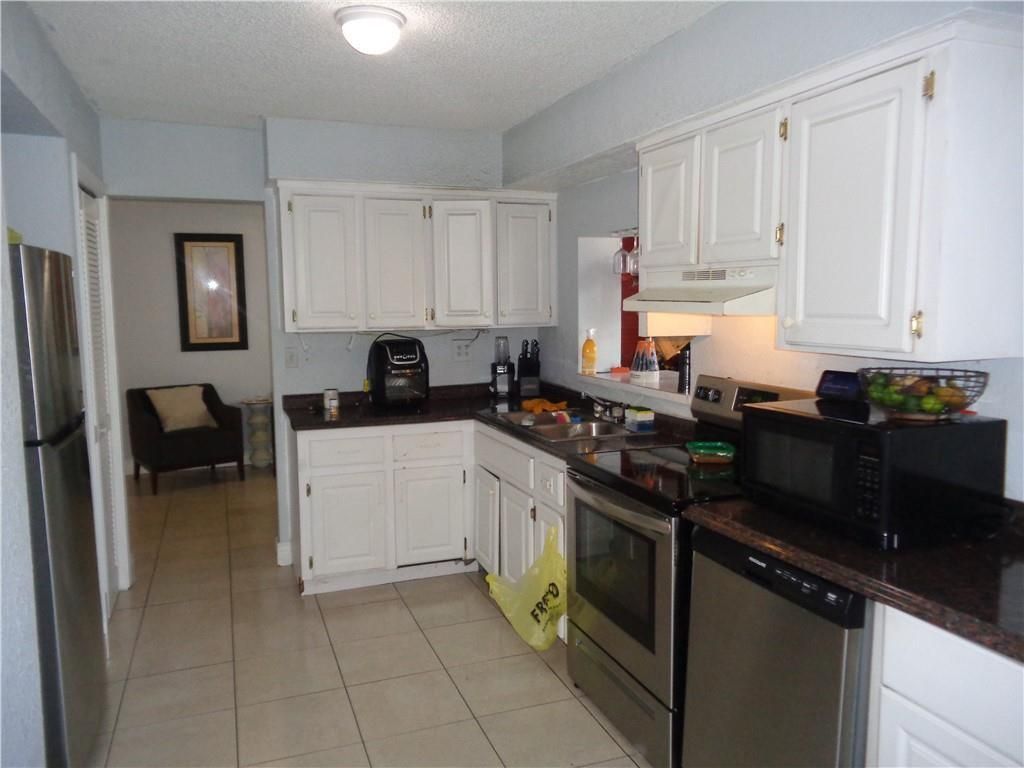 Photo of 9571 Sunset Strip, Sunrise, FL 33322 (MLS # B26011553)