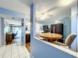 Ground floor condo Welcome to Weldon in Kings Point, a premier community for an active senior lifestyle. This newly remodeled 2 bedroom, 2 bathroom split floorplan model offers a prime 1st floor location with front door parking and convenience to the pool. Updates includes newer kitchen and bathrooms with custom cabinetry, Corian countertops, new wood laminate flooring and blinds throughout. A private screened patio overlooks a canal and greenspace. Manned 24-hr gated security, heated pool, tennis courts, shuffleboard, and a theatre. Courtesy buses available to go to the clubhouse, shows, gym, art/craft rooms, library, indoor and outdoor pool, hot tub/spa and more. Transportation is also available to supermarkets, pharmacies, hospitals and shopping centers. Enjoy the Florida 55+ lifestyle.