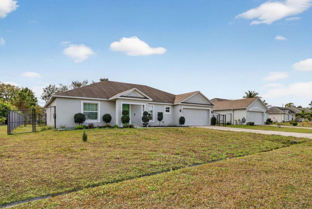 Photo of 1334 SW Axtell Avenue, Port Saint Lucie, FL 34953 (MLS # R11158421)