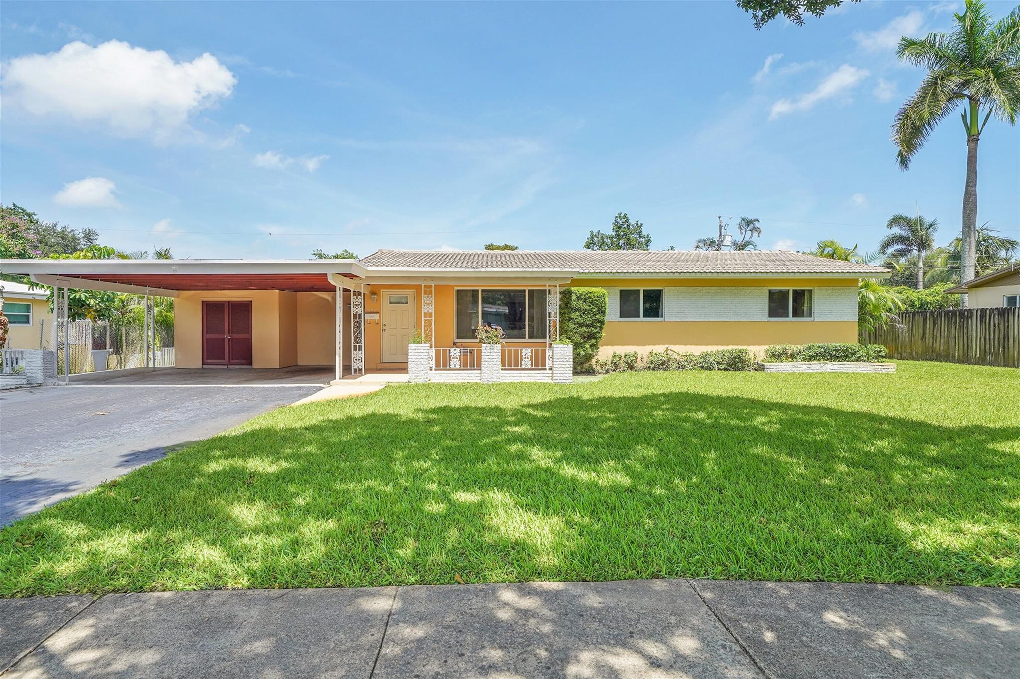 This charming 3-bedroom, 2-bathroom home offers the perfect blend of comfort, space, & convenience. Featuring a spacious living room, family room, formal dining area, & an eat-in kitchen. An attached flex space provides versatility—ideal for a home office or man cave. Situated on a generous 10,000 sq ft lot, the property has no HOA and includes a covered front & back patio, two-car covered carport, & plenty of space for a pool. Key features are 2006 barrel tile roof, impact windows & doors, updated master bathroom, large bedrooms with great closet space. Prime location close to I-595, & just a short drive to downtown Fort Lauderdale. Enjoy nearby amenities such as Broward Mall, Plantation Walk, & The Fountains. Surrounded by top-rated parks, golf courses, & great dining options.