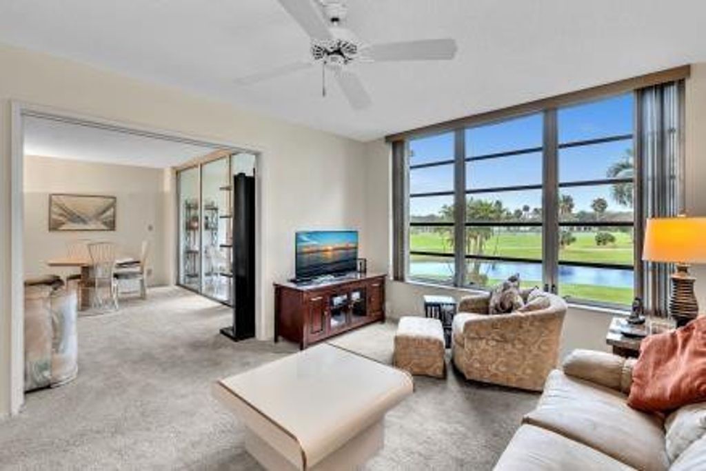 Photo of 3980 Oaks Clubhouse Drive #209, Pompano Beach, FL 33069 (MLS # F10413656)