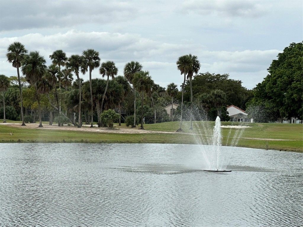 Photo of 3980 Oaks Clubhouse Drive #209, Pompano Beach, FL 33069 (MLS # F10413656)