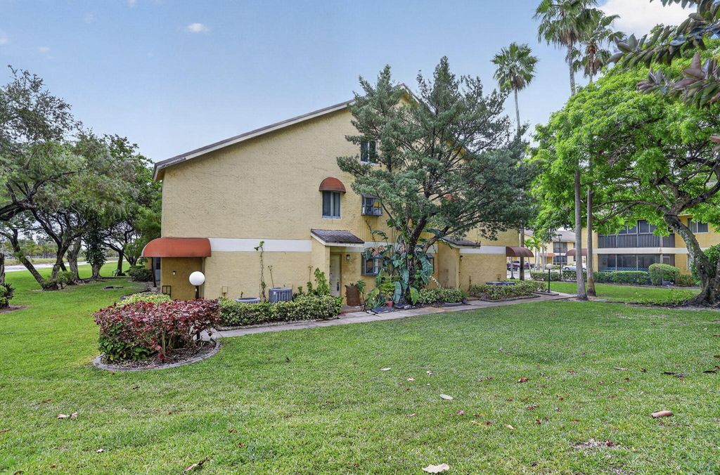 Photo of 3041 N Oakland Forest Drive #103, Oakland Park, FL 33309 (MLS # B26025083)