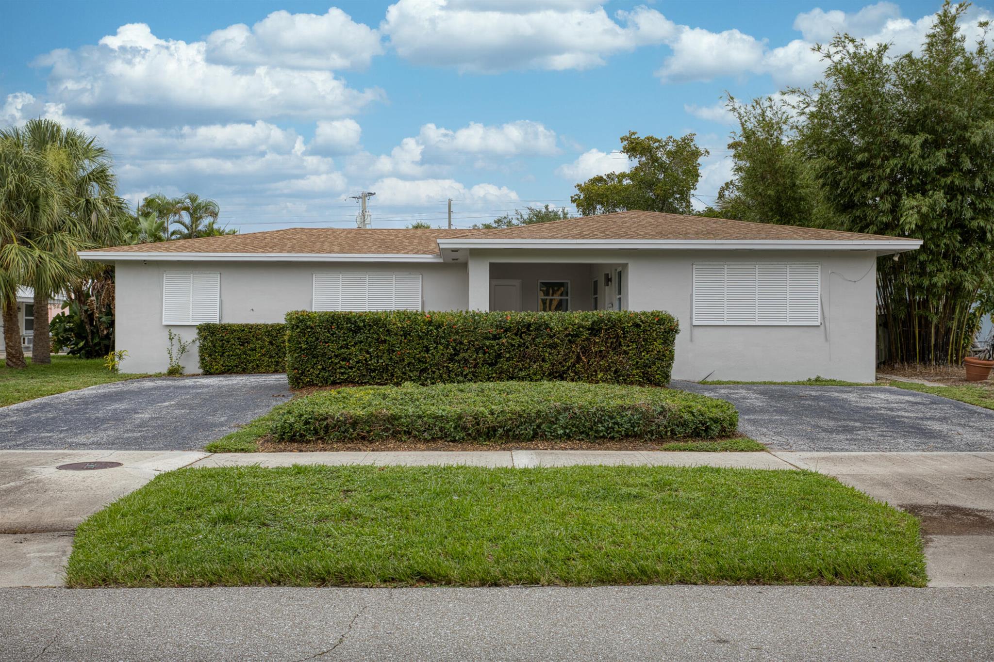 Great investment opportunity for you in the heart of North Palm Beach.. 2BR 2 BA single family home and a duplex with a 2/1 and 1/1. New HVAC units. New mostly impact windows. New flooring. Some updates done with minimal left to do Add to your decorative style. Great outdoor space and plenty of parking for all. Each unit with a separate electrical and water meters. Live in the home and collect the rent from the duplex OR have the entire family stay onsite. Many options at this price. Close to all that NPB has to offer Schedule your showing today