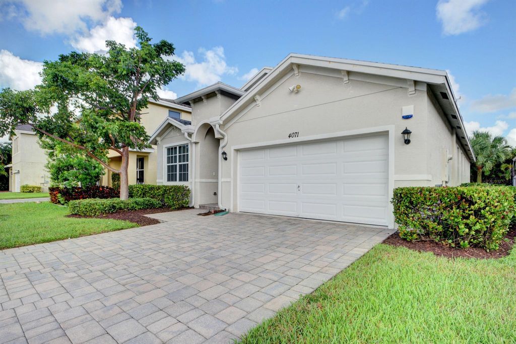 Photo of 4071 Tomoka Drive, Lake Worth, FL 33462 (MLS # R10923637)