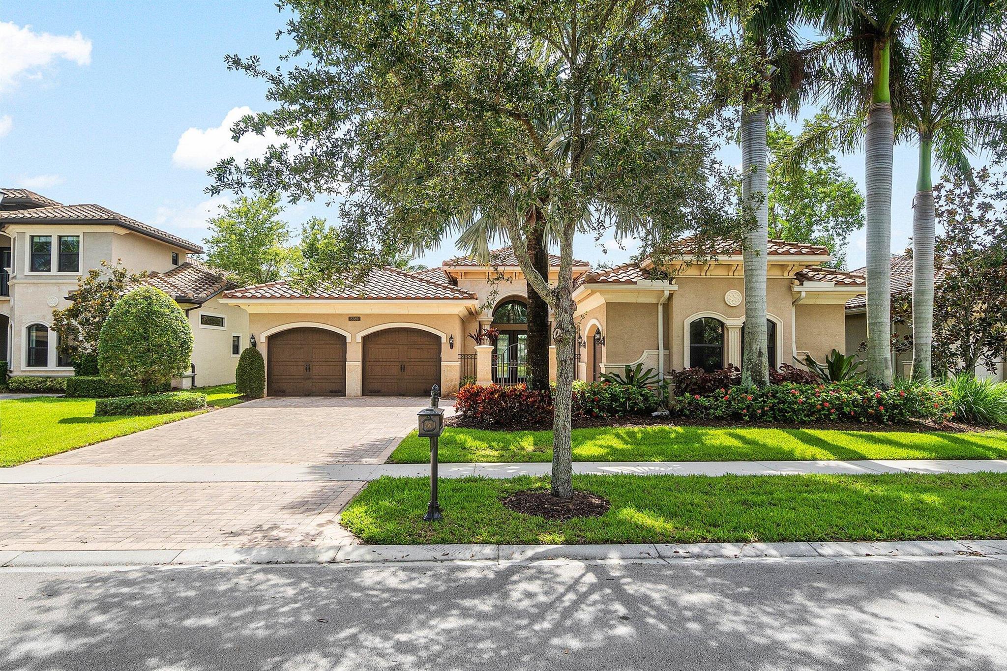 Welcome to this beautifully upgraded Victoria model from the prestigious Luxury Collection in The Bridges, one of Delray Beach's most sought-after gated communities. This 3-bedroom, 3.5-bath residence offers a spacious triple-split floor plan with 12-16 foot ceilings, elegant coffered ceilings, and a HUGE bonus room perfect for a home office, gym, game or media space. The heart of the home is a chef's kitchen featuring high end stainless steel appliances, a gas range, double ovens, 48-inch built-in refrigerator, granite countertops, a large center island, snack bar, and an eat-in dining area with panoramic lake views. Each bedroom includes its own en-suite bathroom, while all closets boast new custom organizers. The home features marble floors, new luxury vinyl plank flooring,