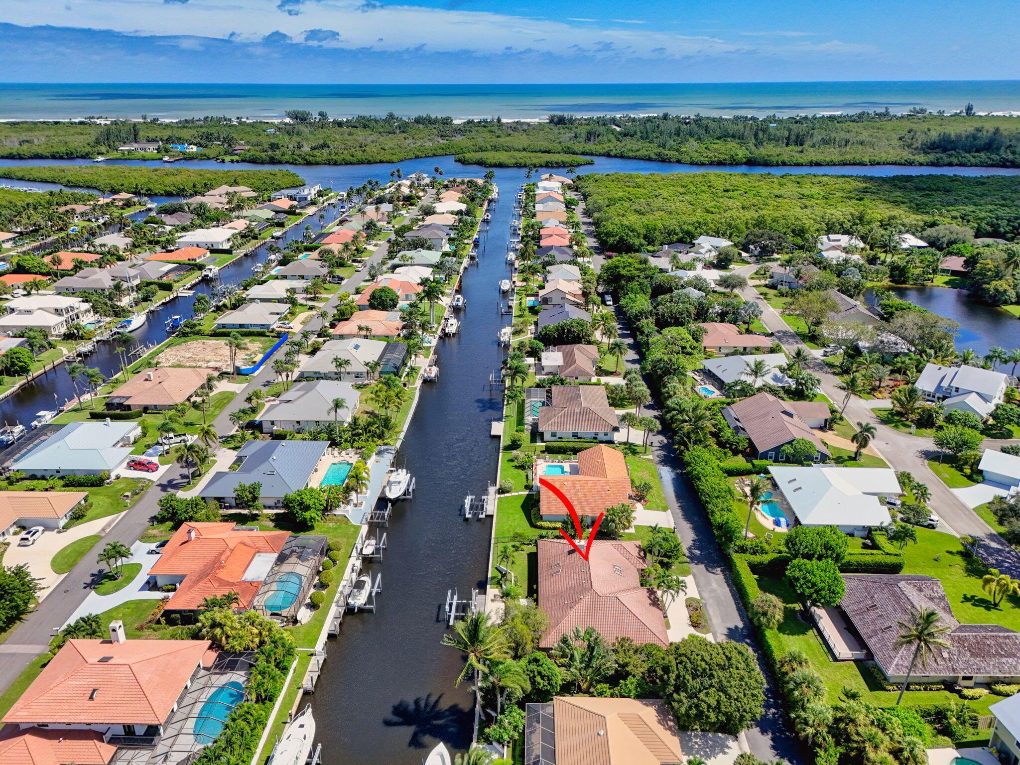 Come experience waterfront living in The Soundings. Iron gates welcome you into this CBS home on a quiet street with no frontside neighbors. Valuted ceilings and an oversized patio lead out to over 100' of beautiful deep water. Split floorplan w/ airy rooms and natural light. HOA amenities include a marina, dog park, pickleball/tennis courts, a boat ramp, a community pool/clubhouse, and a storage yard for boats and RVs. Direct access to ICW - No fixed bridges to the ocean via Jupiter & St. Lucie Inlets.Hobe Sound offers small-town charm, boutique shops, and excellent schools (The Pine School). Golf cart to the beach, or boat to local waterfront restaurants. We have it all. (There is a capital contribution at closing of $1500)