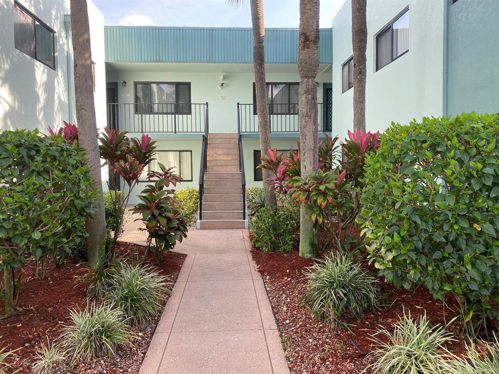 Settle right in to this fully remodeled, beautiful, lakefront condo. Large patio offers a private lake view. The lovely kitchen opens to the dining room and living room and includes new wood cabinetry, quartz countertops, marble backsplash and new s/s appliances. Both bathrooms are updated with new vanities, tile work, fixtures and custom frameless shower door in the primary bath. New A/C, laminate wood flooring, and interior paint. 2015 water heater. In unit w/d. Assigned parking space. New lift in building. Enjoy all the amenities that Lakes of Delray has to offer. All measurements approximate. Owner-agent.